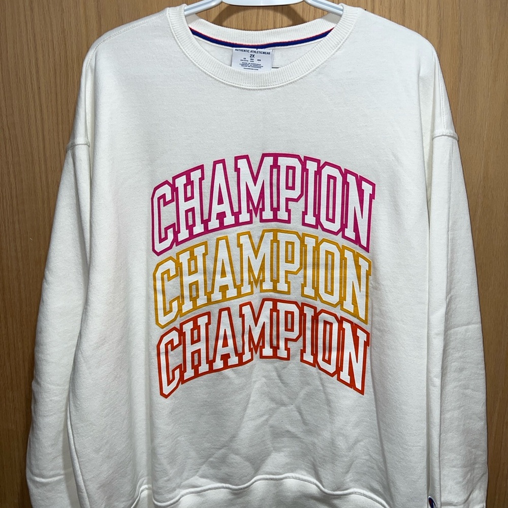 Champion Cream Sweatshirt with Vibrant Logo